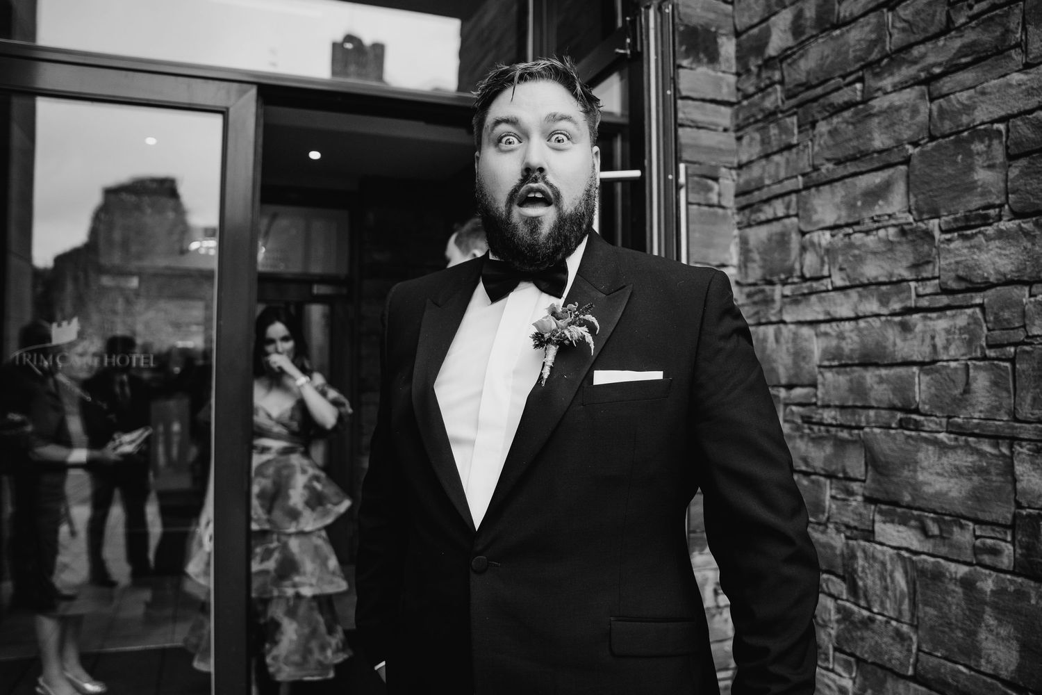 Formal evening event at a venue with stone walls and elegant lighting. Wedding Photography Trim Castle Ireland