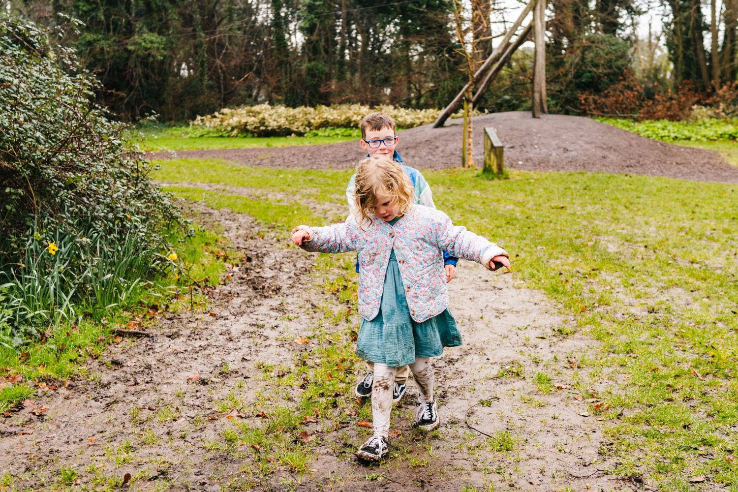 Family photographer Dublin Ireland  Dancing and twirling on a spring path surrounded by nature.