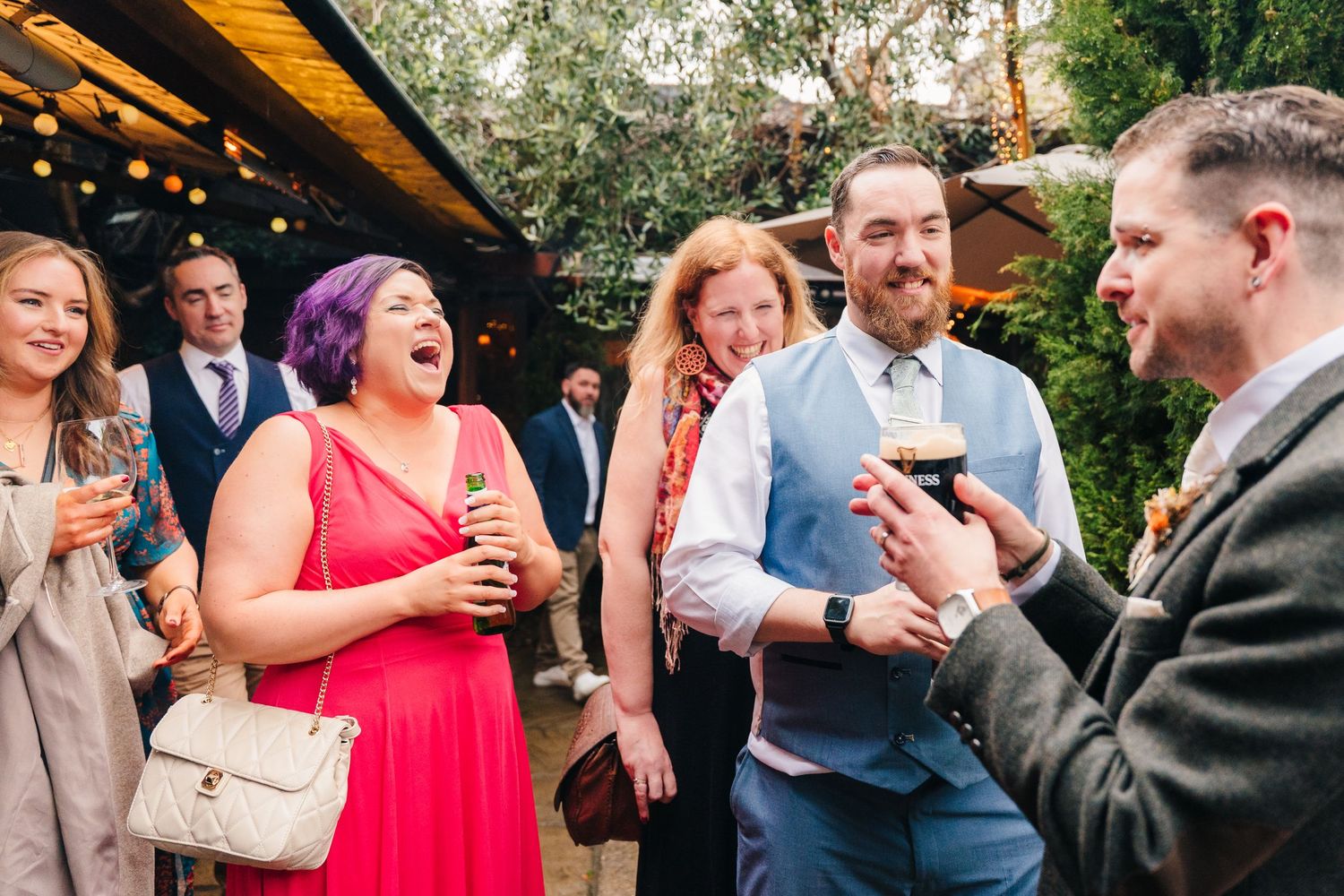 Marco Pierre Dublin Wedding Photographer Wedding guests mingling and socializing during an outdoor cocktail reception.
