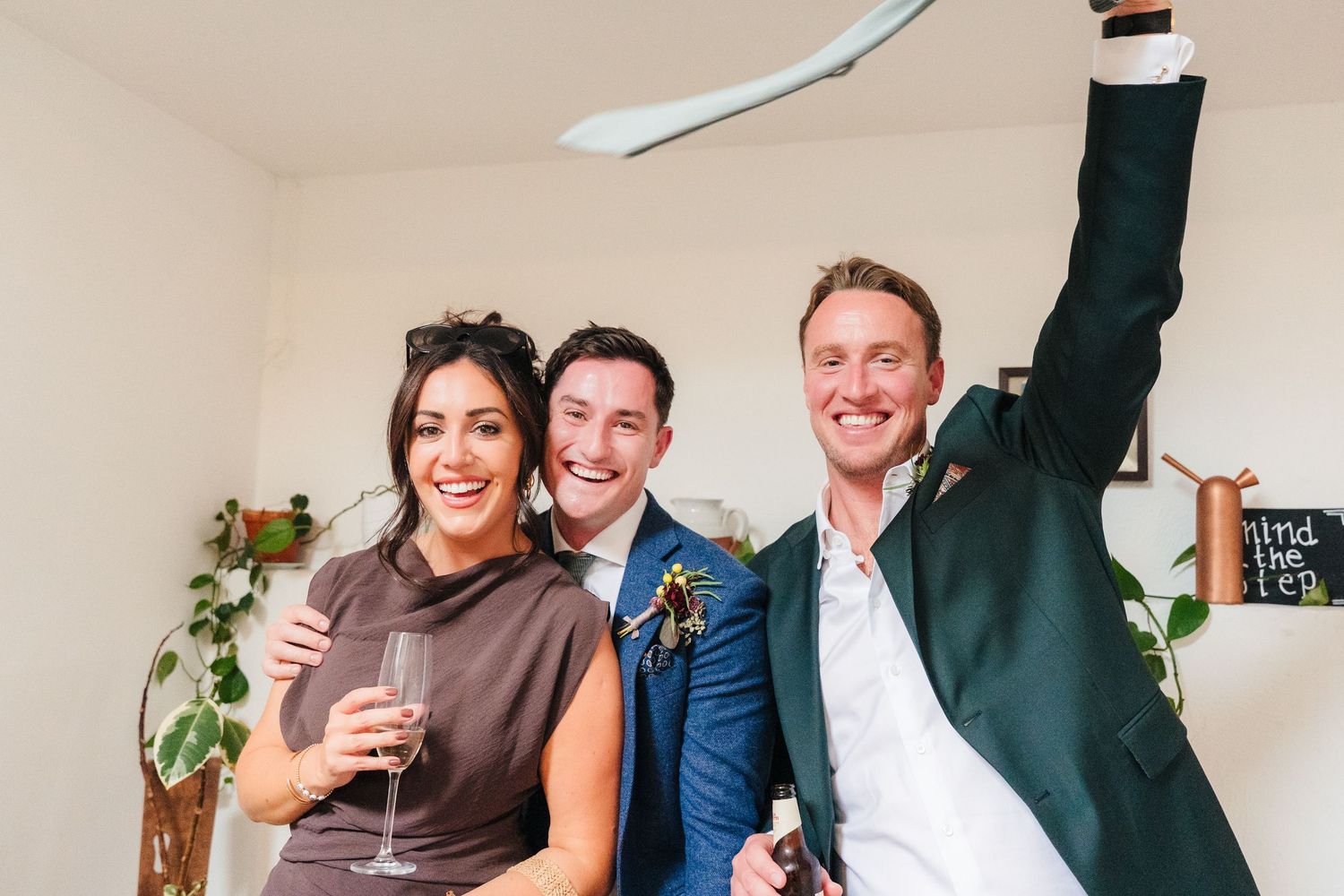 Guests laughing and socializing during an indoor celebration. Same sex wedding PHOTOGRAPHER Dublin