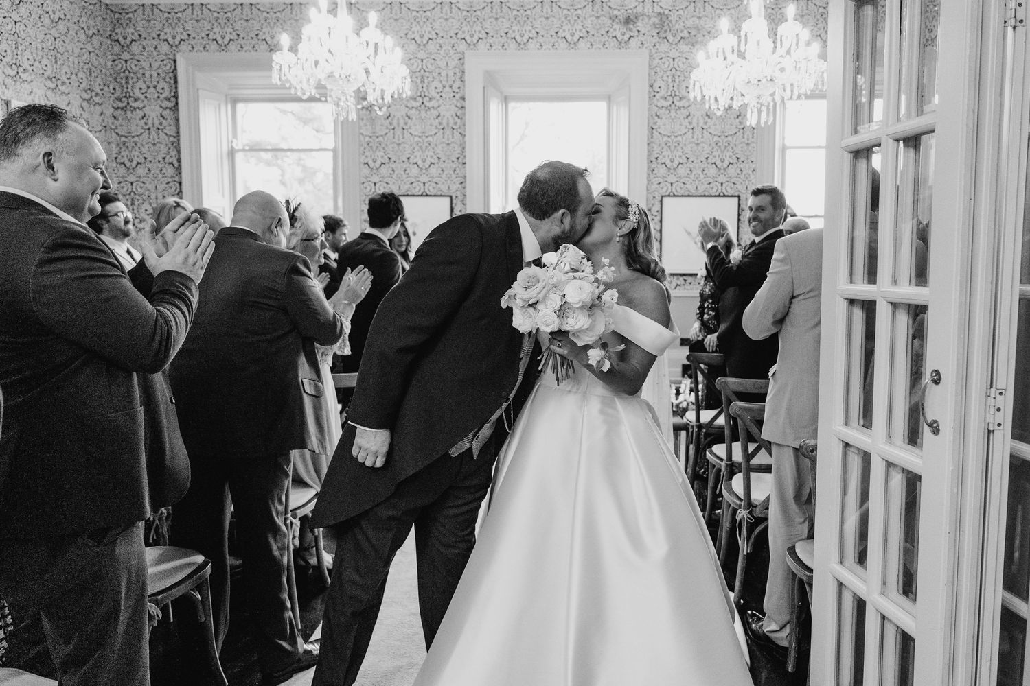 Elegant wedding venue interior with crystal chandeliers and ornate wallpaper.  Virginia Park Lodge Wedding Photographer Cavan Dublin Ireland