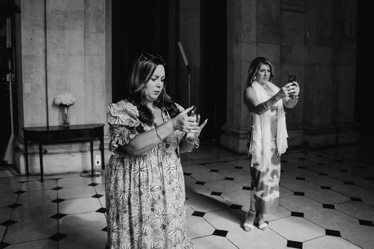 Black and white wedding photos displayed in a dramatic sequence showing guests in formal attire.  city hall dublin wedding photos