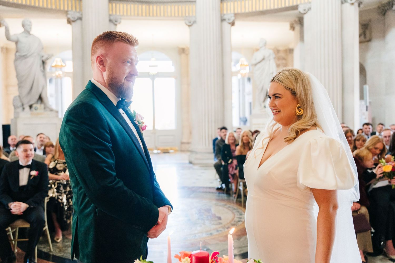 Wedding ceremony in grand historic venue with classical columns and marble details.Wedding photographer dublin