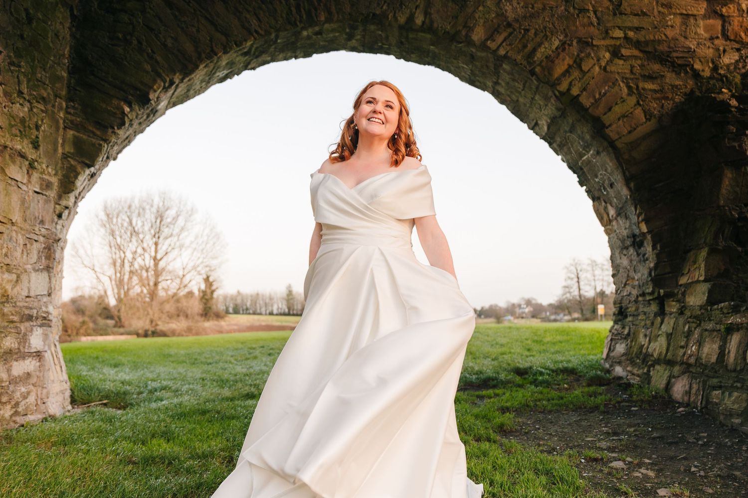 Romantic wedding portraits captured through ancient stone archways in natural light.  Wedding PHOTOGRAPHER Trim Castle