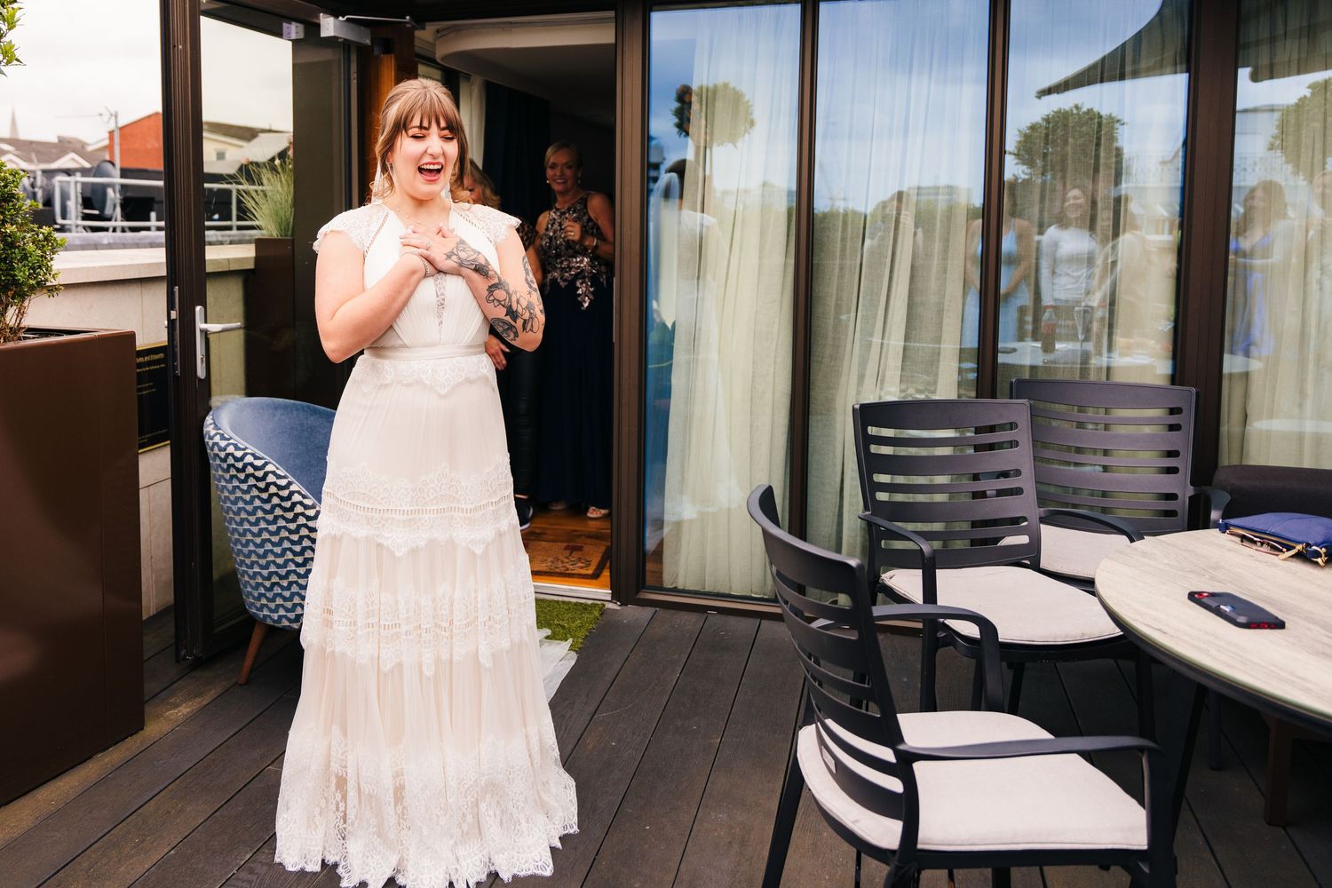 Modern hotel balcony with glass railings and lounge furniture.PHOTOGRAPHER Dublin Ireland Wedding