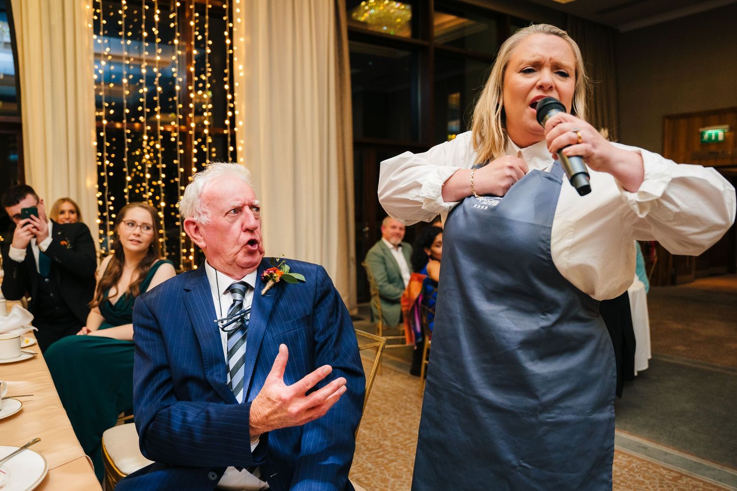 People sharing emotional moments during wedding reception speeches.Wedding Photography Trim Castle Ireland