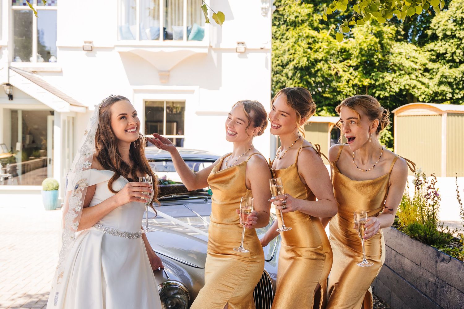 Poulaphouca Wedding photographer wicklow  Wedding party laughing together outdoors on sunny summer day.