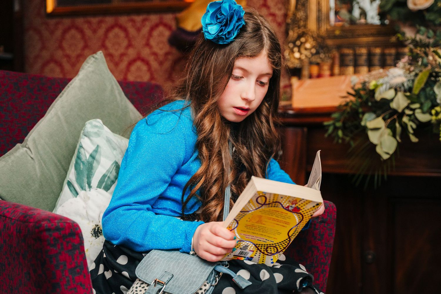 Children engaged in an activity at an event wearing formal attire and interacting with items on a table. Marco Pierre Dublin Wedding Photogr