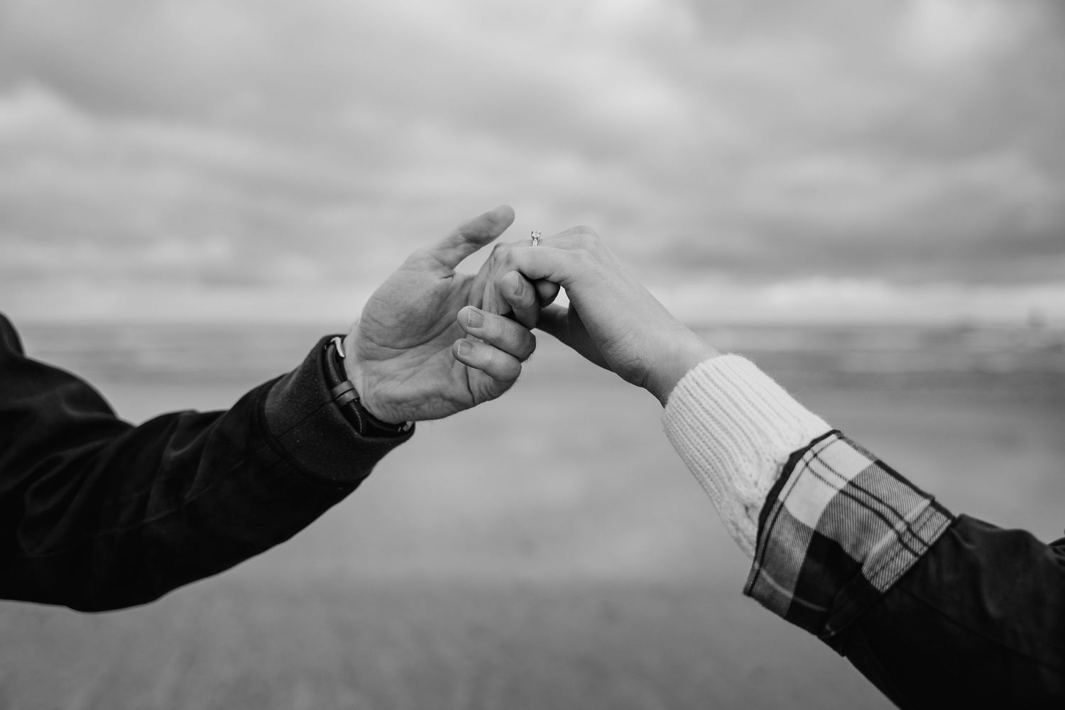 A sequence of six black and white photos shows a hand gesturing against a cloudy sky in different positions. PHOTOGRAPHER Dublin ireland