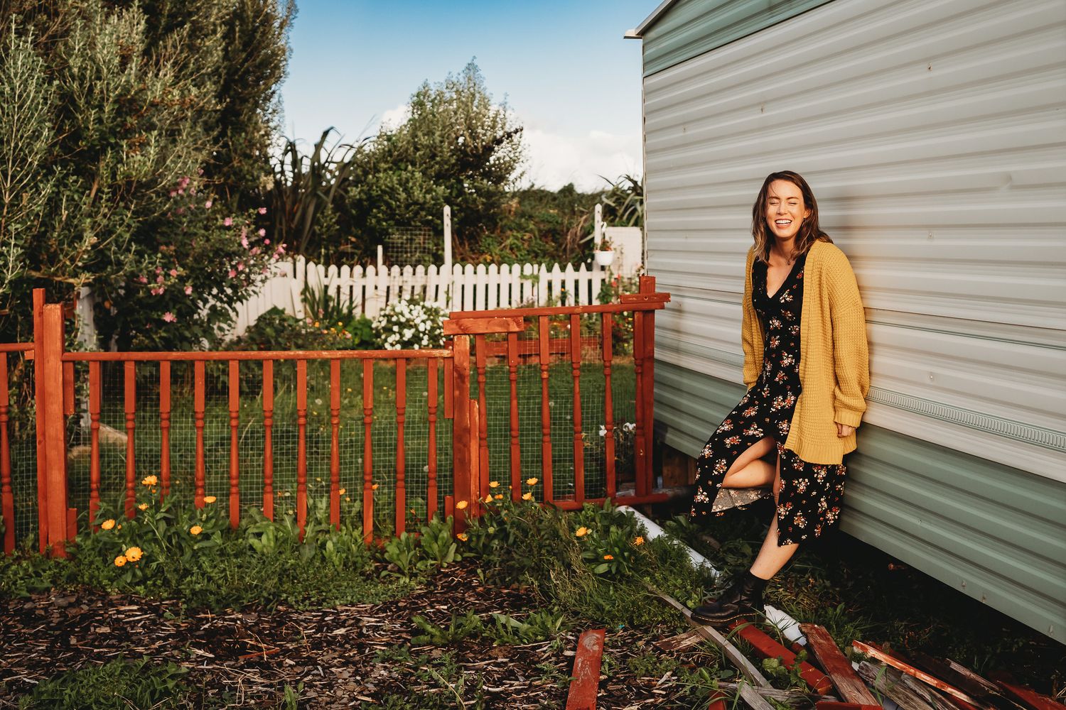 A sequence of photos showing someone taking fall leaves from their yard and placing them in a compost bin near their house. PHOTOGRAPHER Dub