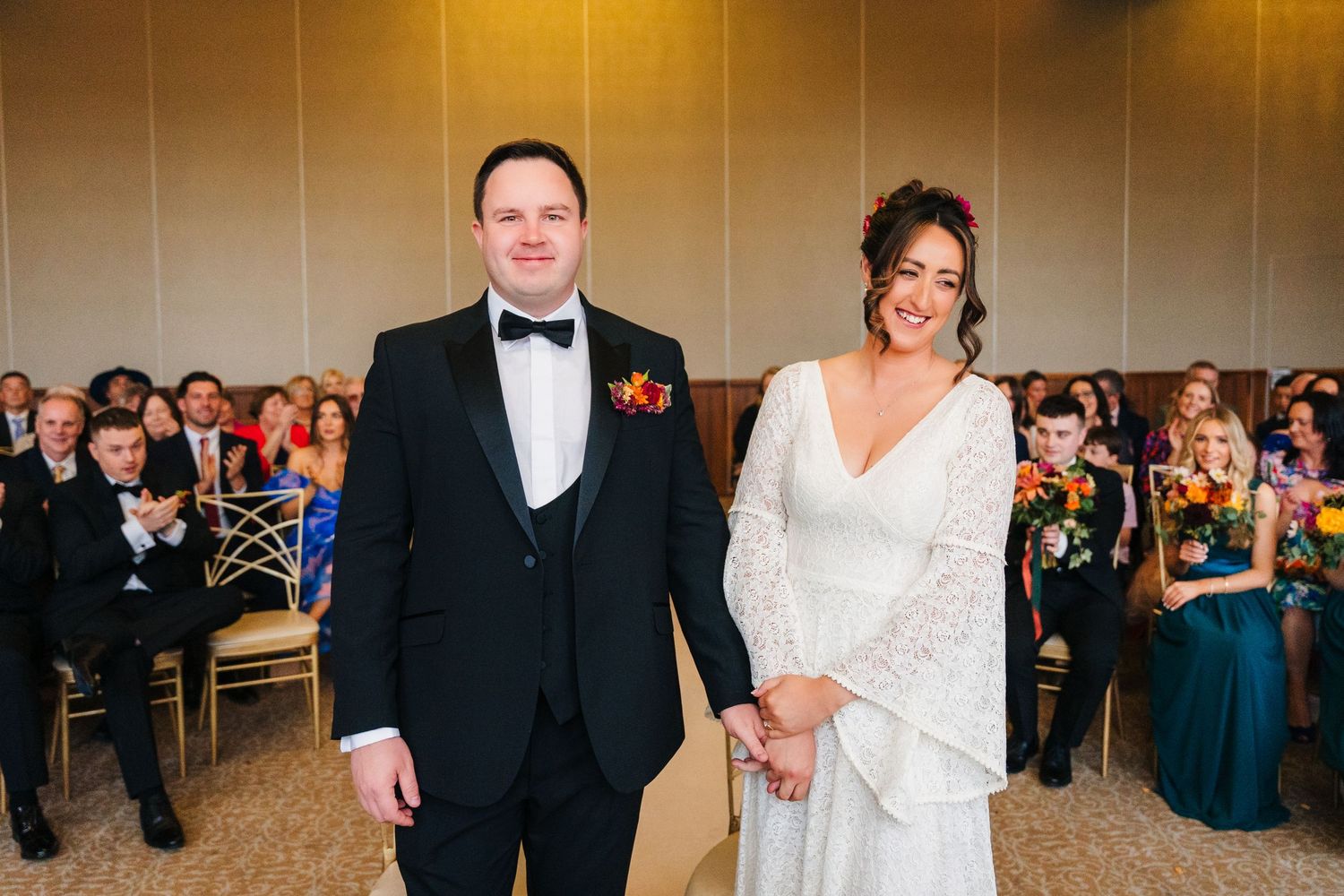 Wedding celebration inside elegant ballroom with guests and formal decorations. Wedding Photography Trim Castle Ireland