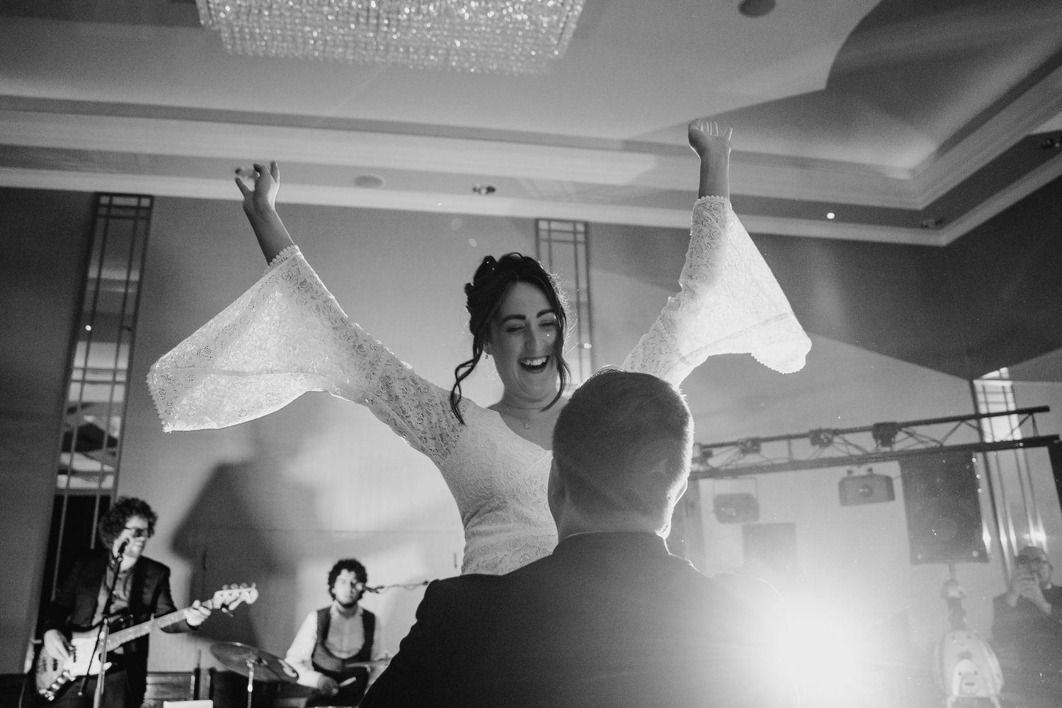 Black and white photo of a lively wedding reception dance party.Wedding Photography Trim Castle Ireland