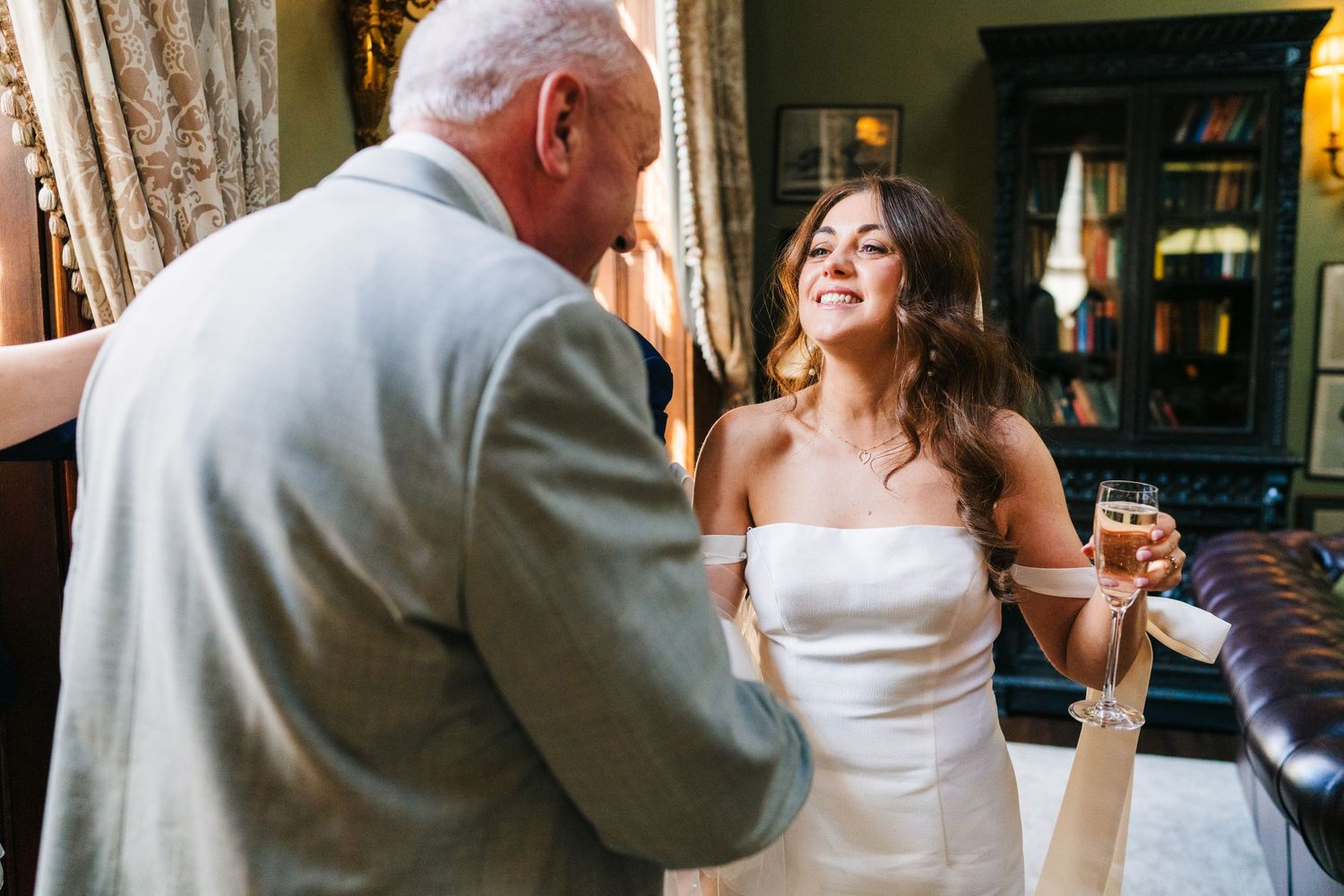 Castle Leslie Wedding PhotographerCandid moments of wedding party celebrations with guests mingling and dancing in an elegant indoor venue.