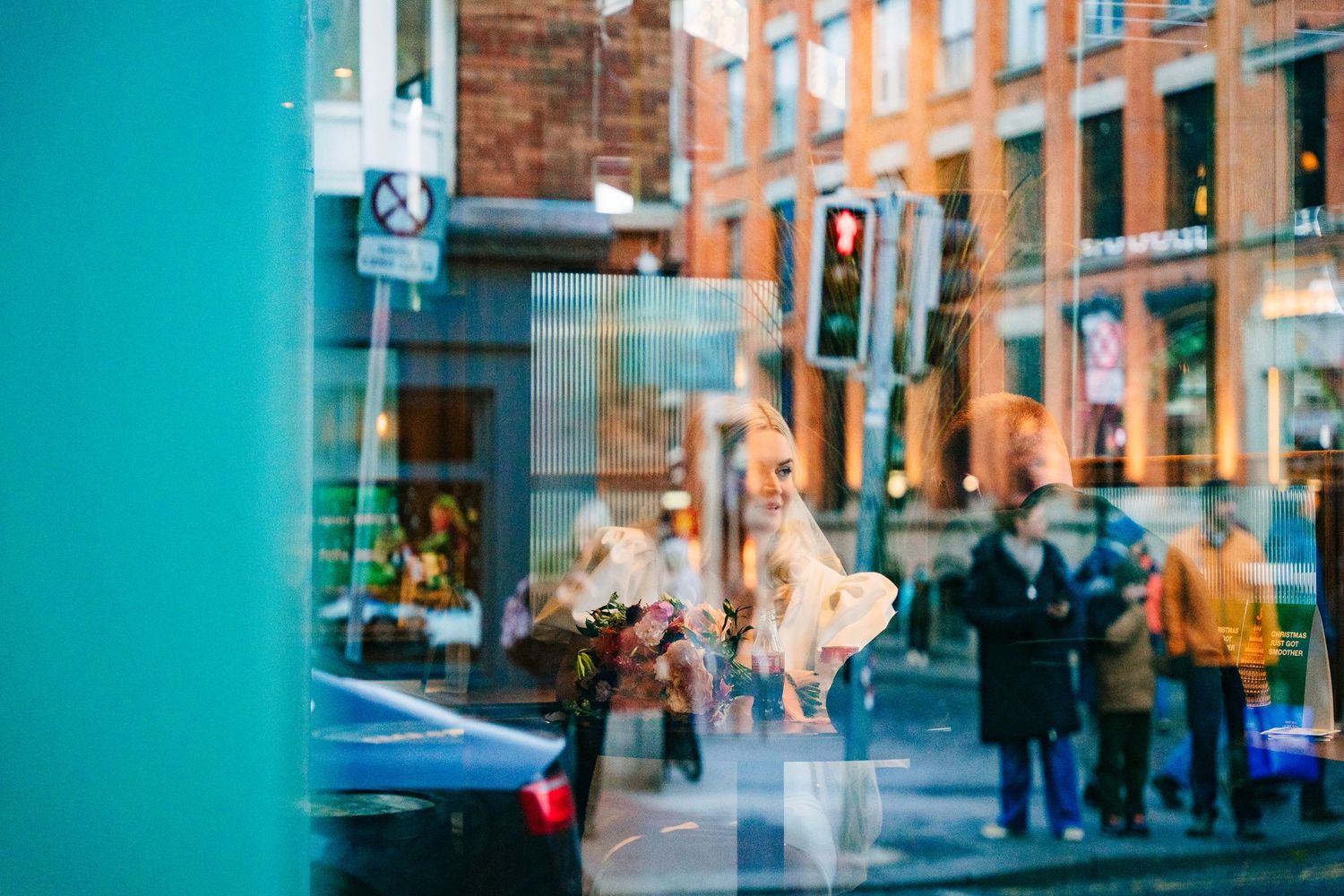Urban wedding photos with teal and brick backdrop featuring modern city architecture. City Hall Dublin Photographer