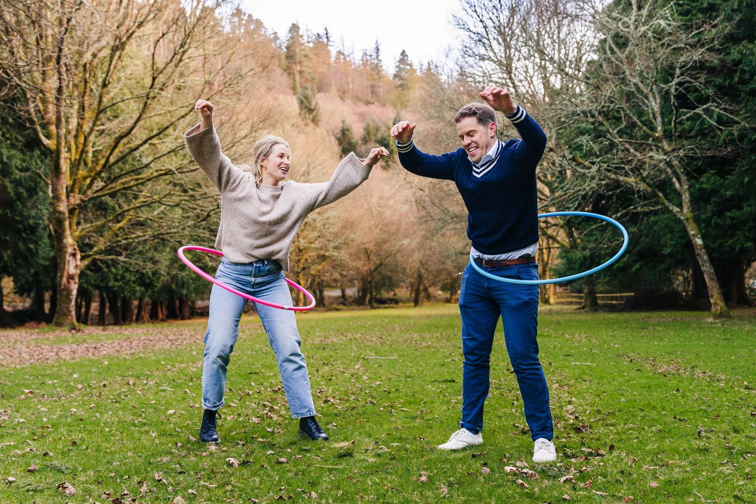 Seven sequential photos show people playing with hula hoops in a grassy park area surrounded by autumn trees. PHOTOGRAPHER Dublin ireland
