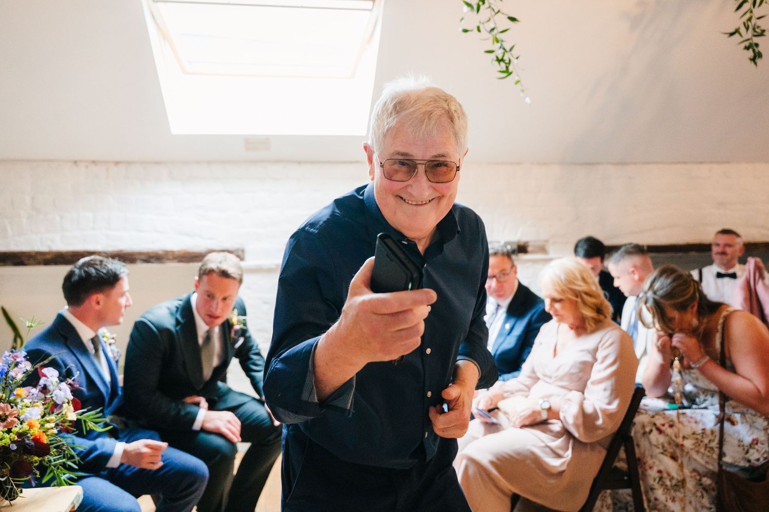 Wedding guests mingle and socialize during a lively reception celebration. Same sex wedding PHOTOGRAPHER Dublin