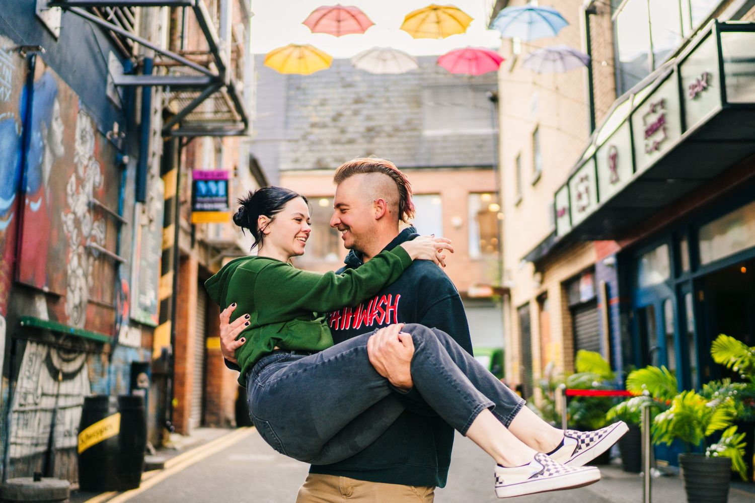 Romantic scene under colorful umbrellas in a charming Dublin alleyway. PHOTOGRAPHER Dublin Ireland