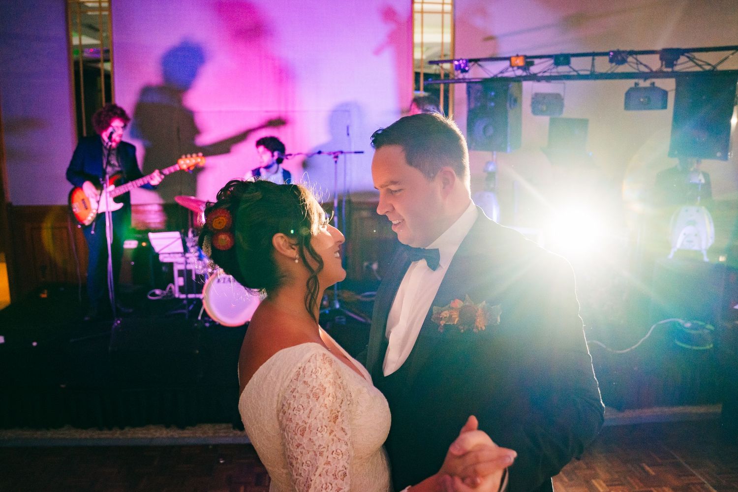 Couple sharing romantic first dance with band performing in background at wedding reception.Wedding Photography Trim Castle Ireland
