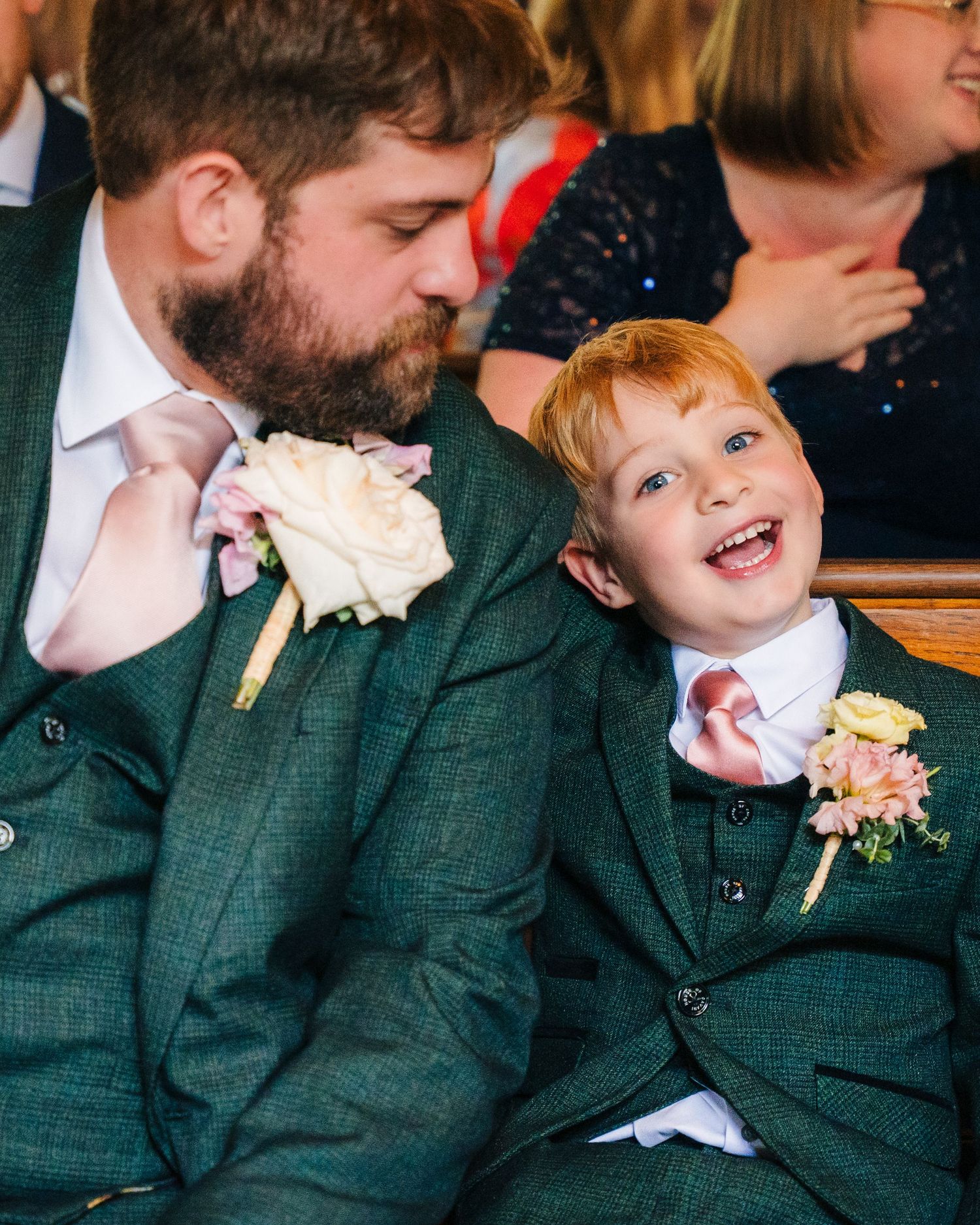 Four warm and candid interactions are captured in a sequence showing laughter and joy at a wedding celebration. . Village Barn Tyrrellspass