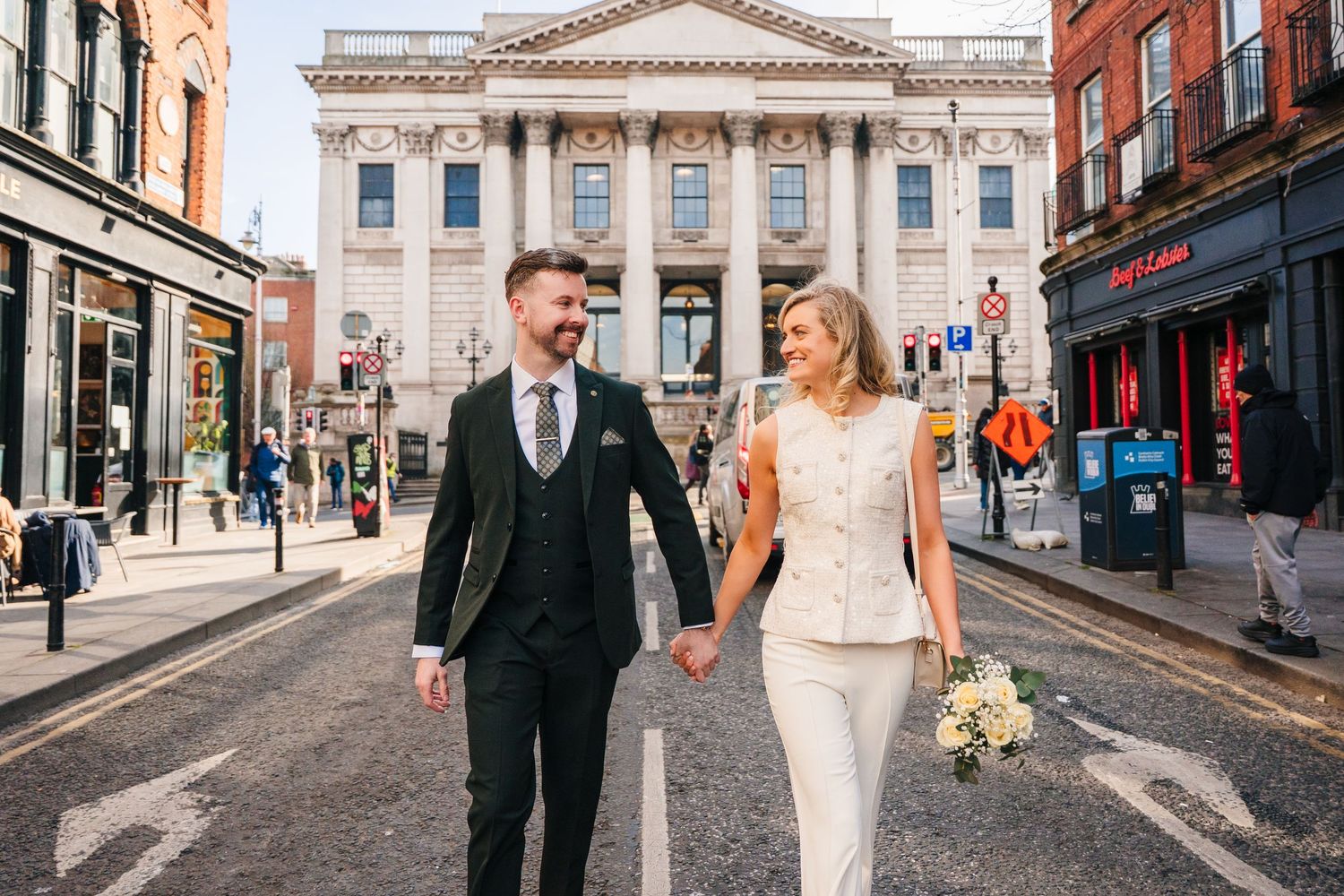 Scenic urban street with classical architecture and red brick buildings. City Hall Dublin wedding photogrAPher