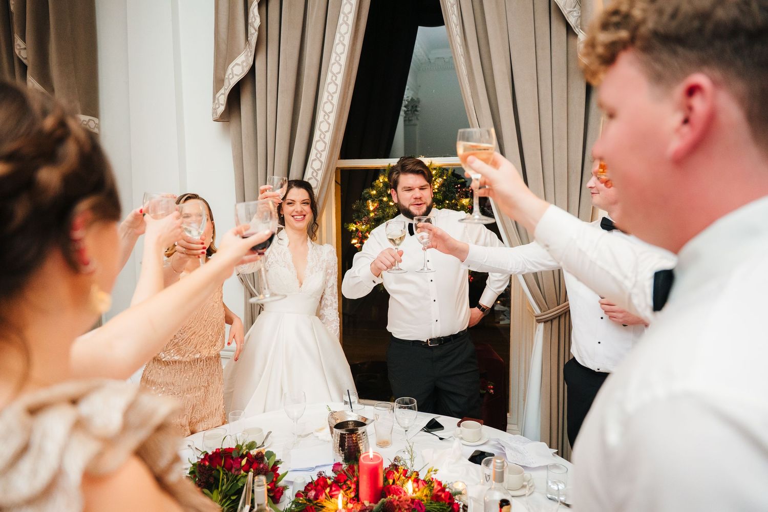 Wedding reception guests mingling and celebrating at decorated tables. Stephens green club dublin Wedding photographer