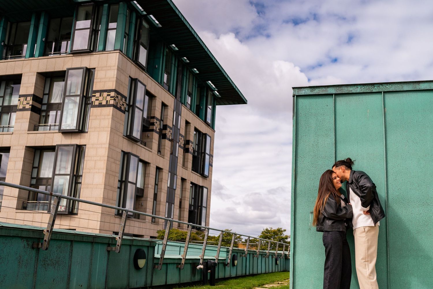 Architectural shots of modern apartment buildings with green and beige facades on a cloudy day. Couple's Photoshoot PHOTOGRAPHER Dublin