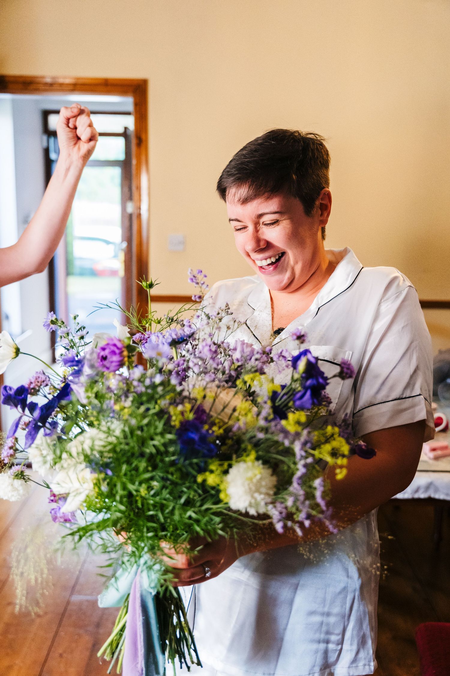 Millhouse slane wedding photographeBeautiful floral arrangement featuring purple and white flowers being displayed in natural light indoors.