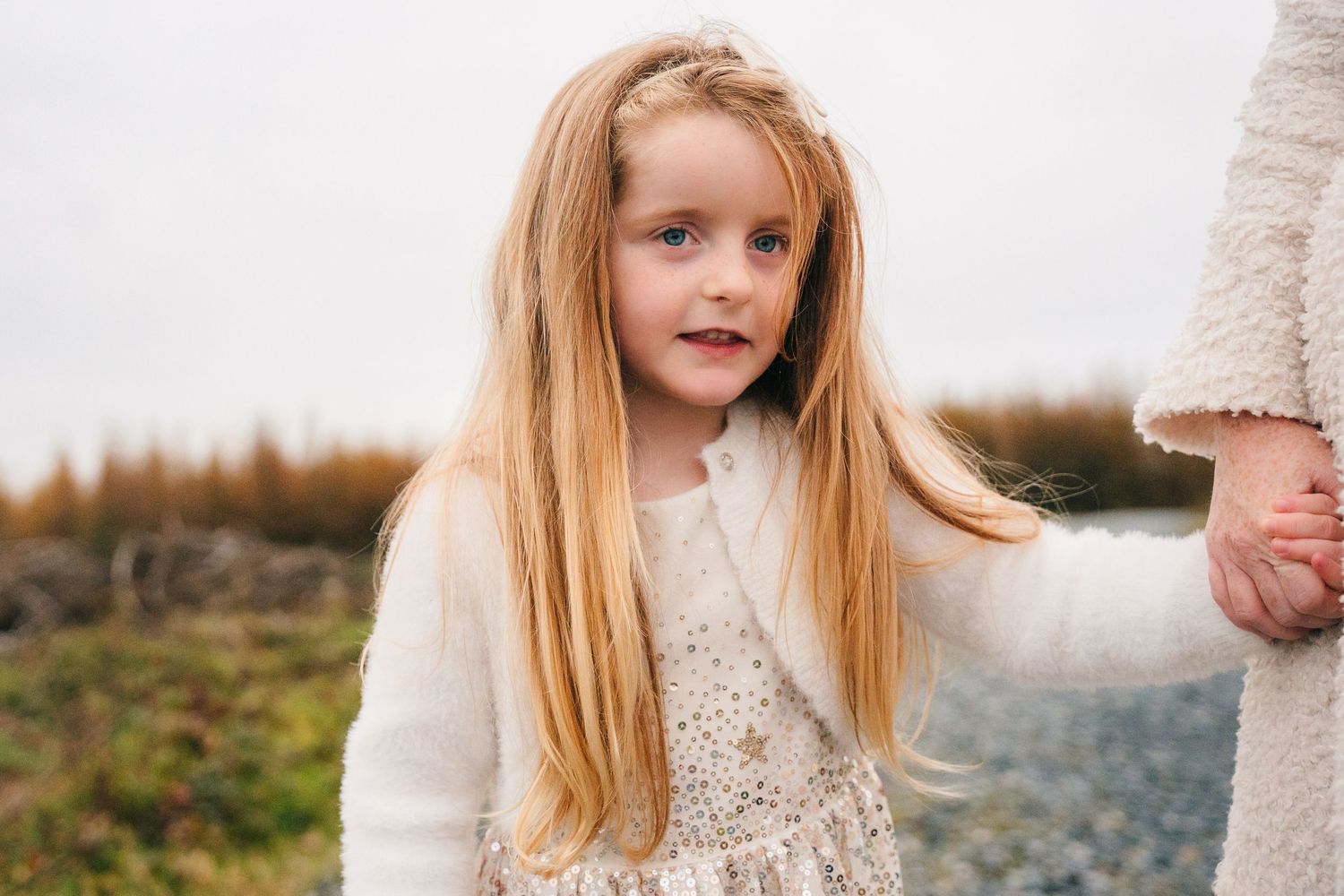 Family Photographer Dublin Ireland  Soft portrait against white background featuring cream colored clothing.