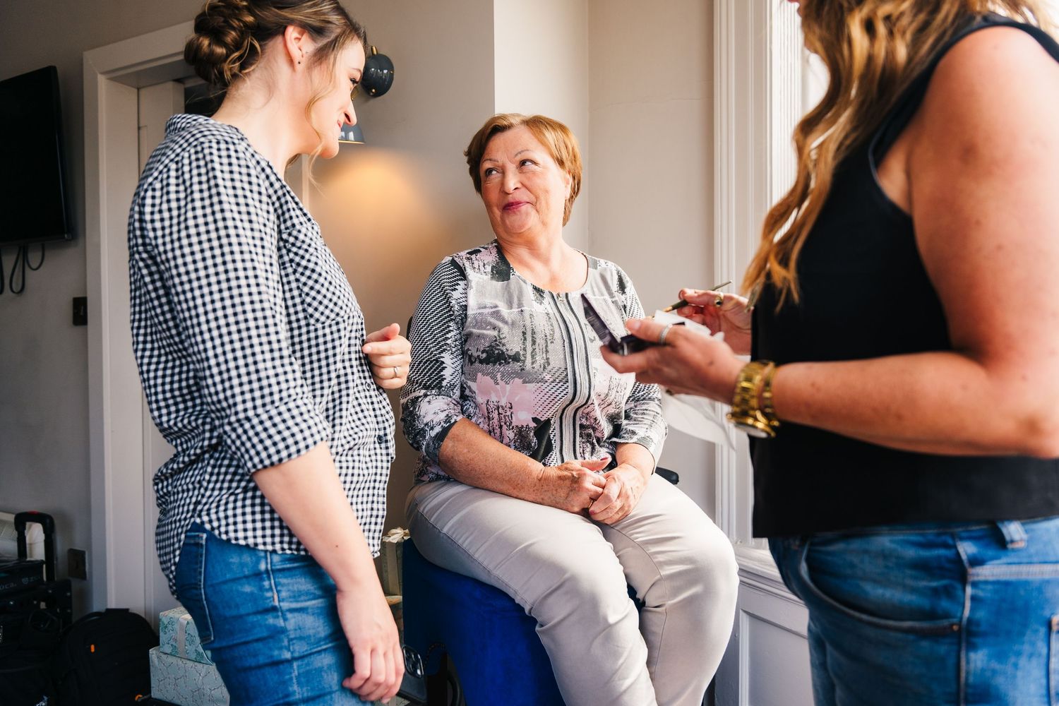 People in casual clothing gather in an indoor space for a social event. House Dublin Wedding Photographer