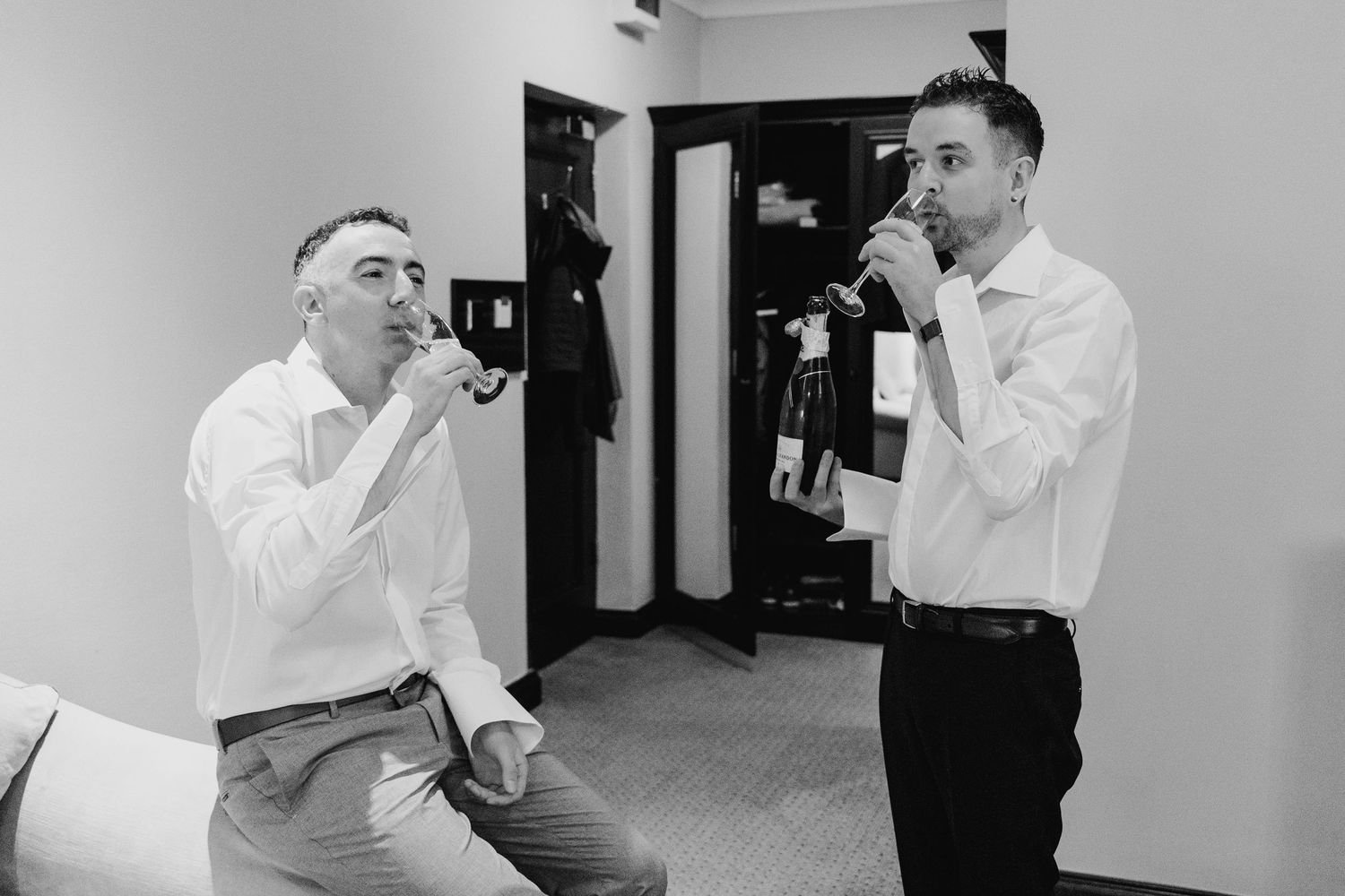 Collection of black and white photos showing celebratory champagne spraying moments at an event. Marco Pierre Dublin Wedding Photographer