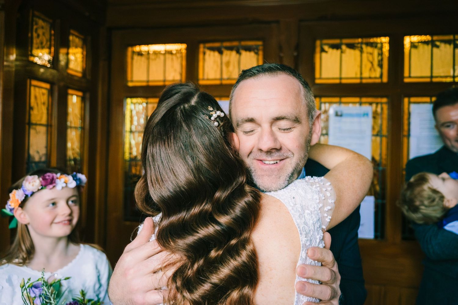 Wedding celebration sequence showing candid moments in a warmly lit indoor venue.