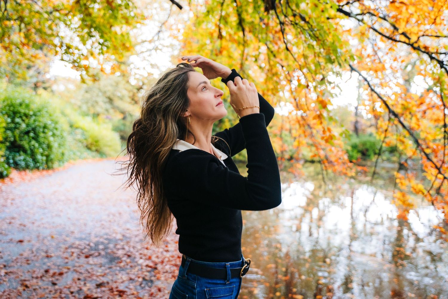 Fall fashion photography with golden leaves and natural lighting in park setting. professional headshots dublin photographer