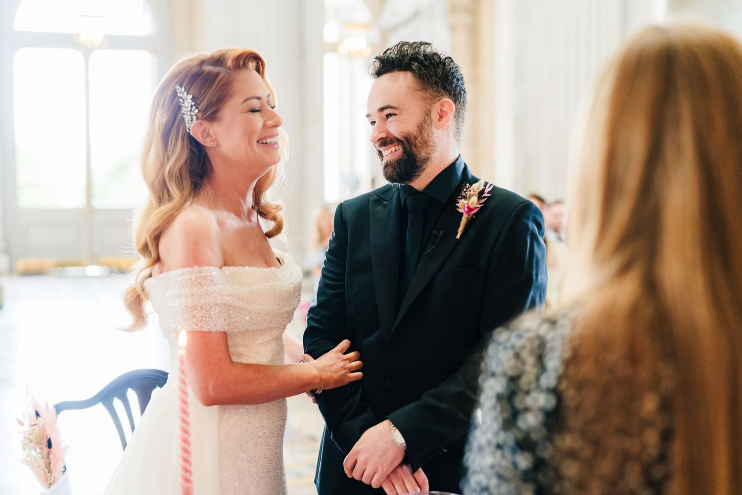 A joyful wedding celebration moment captured in a bright indoor venue.  city hall dublin wedding photos