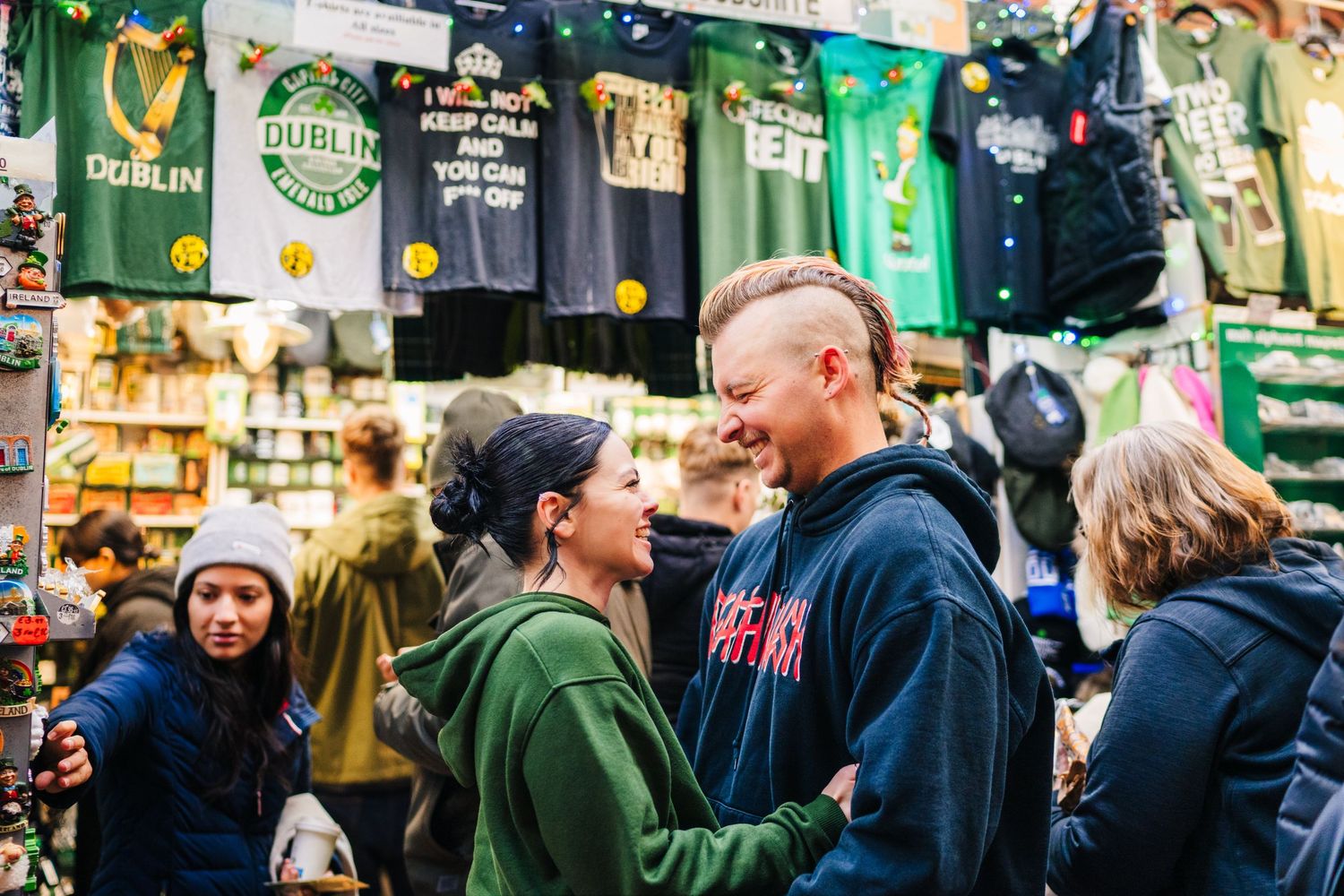 Candid moment in a souvenir shop with Irish merchandise and jerseys displayed. PHOTOGRAPHER Dublin Ireland