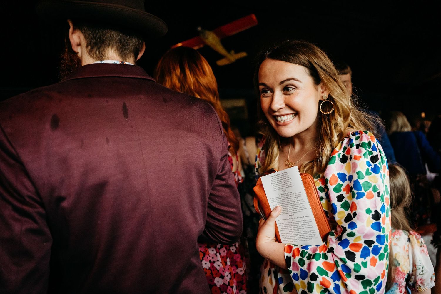 Candid moments captured during an indoor wedding reception celebration. Wedding photographer Dublin