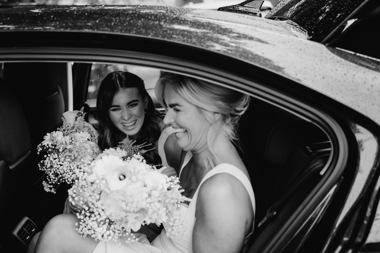 Black and white wedding photos showing people entering a luxury vehicle while holding white floral bouquets. The Dean Dublin Wedding Photogr