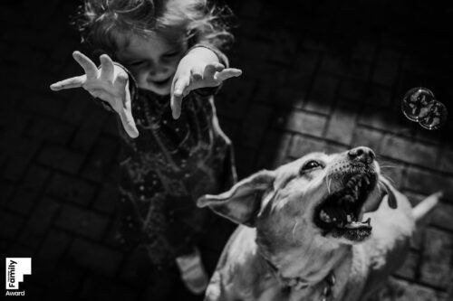 Black and white candid photography showing playful moments and movement. PHOTOGRAPHER Dublin
