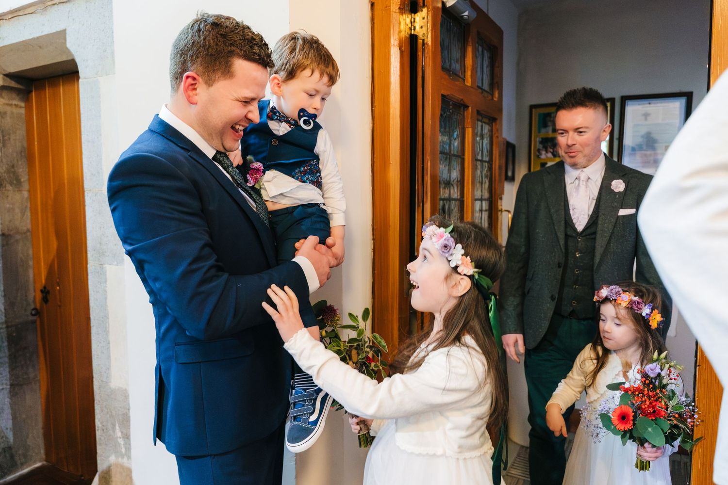 Intimate wedding moments captured in a sequence of candid photographs inside a rustic venue.