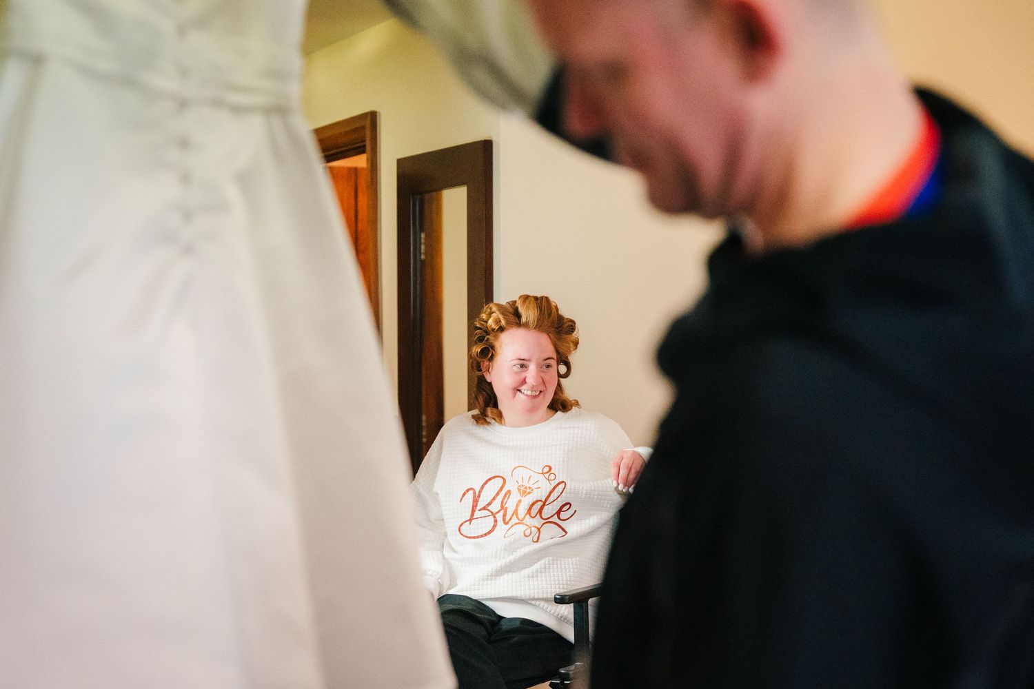 A bride and groom share an intimate moment together during their wedding day. Trim Wedding Photographer