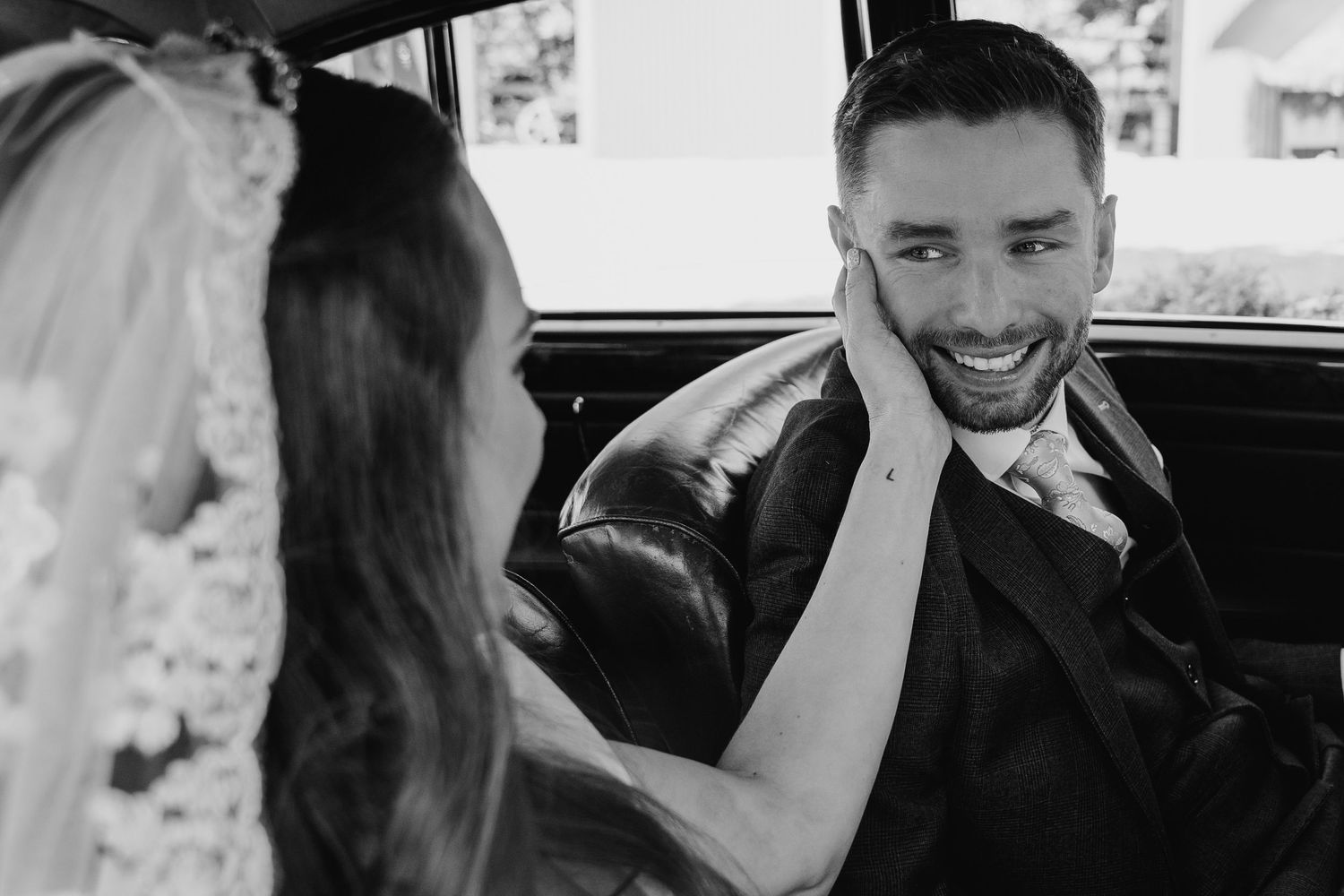 A sequence of black and white photos capturing moments between people inside a car.Poulaphouca Wedding photographer wicklow