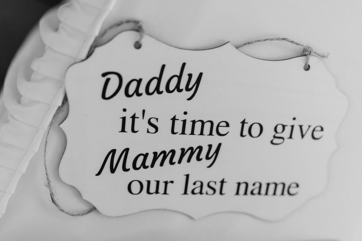 Text on a light background reads 'it's time to give our last name' in cursive font with floral decorative elements.  Wedding PHOTOGRAPHER Du