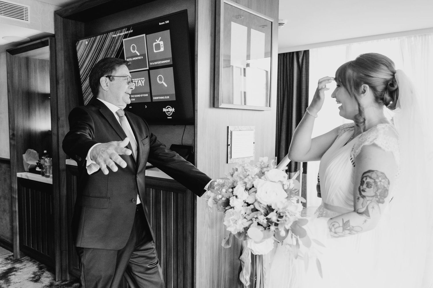 Black and white wedding preparation scene in an elegant room. PHOTOGRAPHER Dublin Ireland Wedding