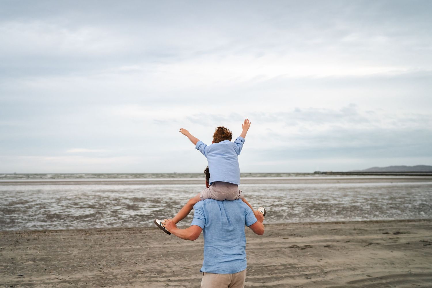 Scenic beach landscape photos with people enjoying the vast sandy shoreline.  Family photographer Dublin Ireland