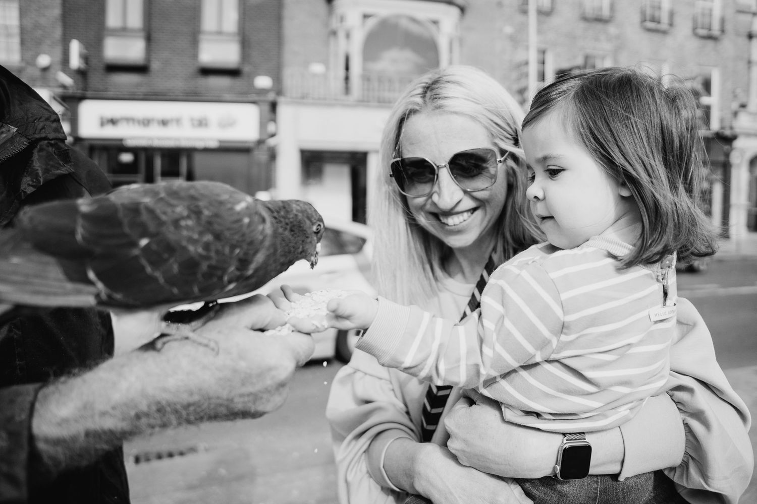 A collection of black and white photos showing people enjoying tender moments with babies and small children. Photographer dublin ireland