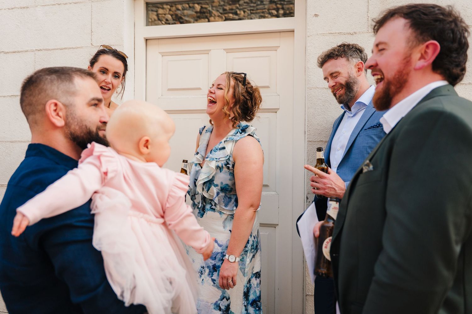 Candid moments of wedding guests mingling and celebrating at an outdoor venue. Same sex wedding PHOTOGRAPHER Dublin