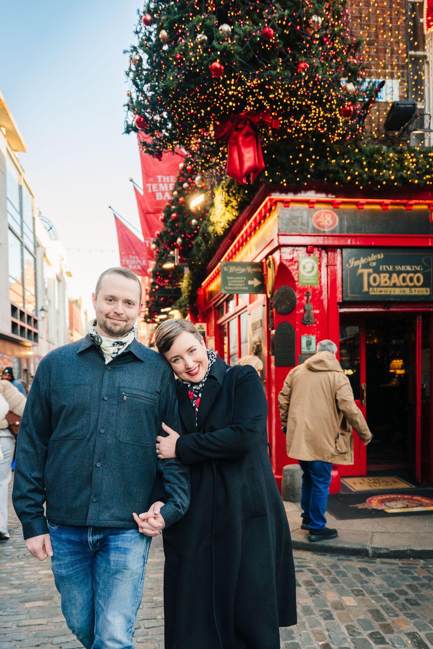 Family walking through Dublin city centre during a relaxed vacation photo session with a family photographer Dublin