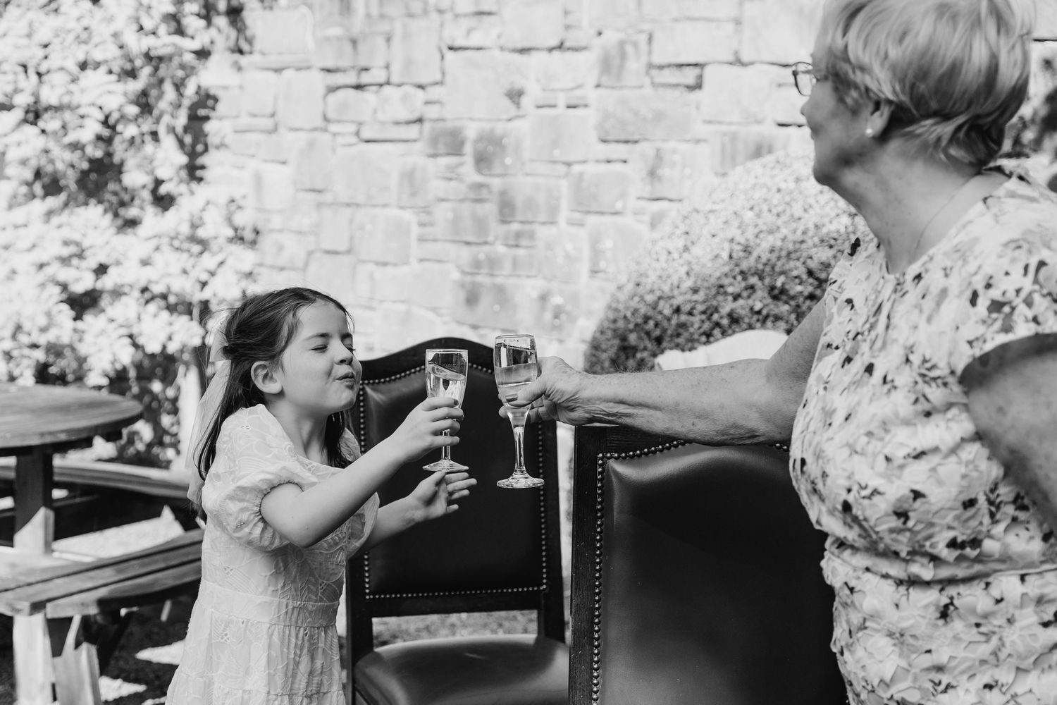 A vintage black and white photo showing an outdoor gathering with refreshments being served. wedding photographer dublin