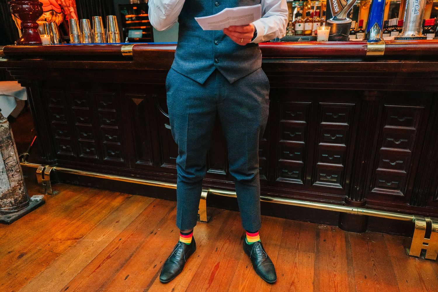 Polished wooden bar with stools and warm ambient lighting. Marco Pierre Dublin Wedding Photographer