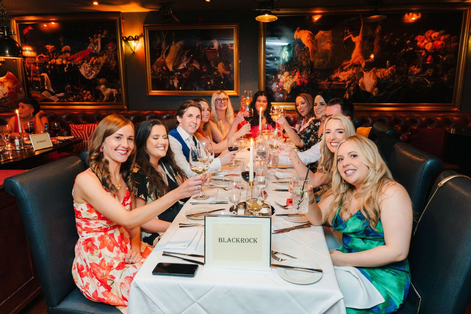 Marco Pierre Dublin Wedding Photographer Guests dining at elegant restaurant tables with warm ambient lighting.