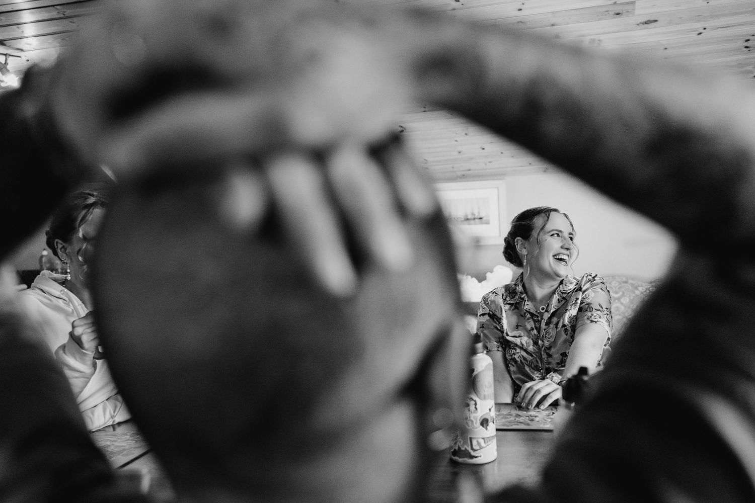 Poulaphouca Wedding photographer wicklow Black and white photo capturing emotional candid moments at a wedding celebration.